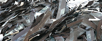 Waste silver bearing photographic film.